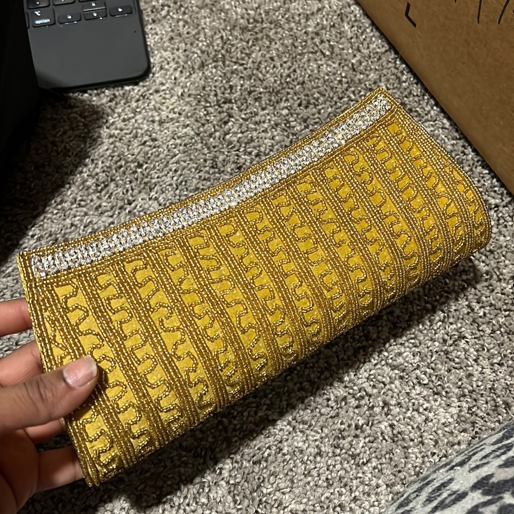Gold unused clutch purse